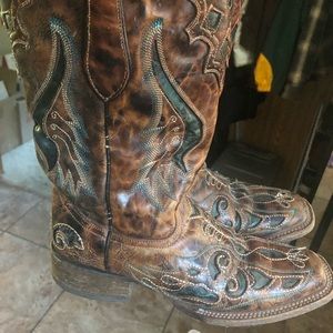 Authentic leather cowboy boots.  These were bought for $270 at a horse expo.